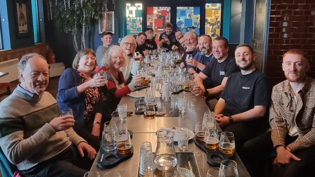 Customers were invited to join the special event and are seated around the table at Brewpoint