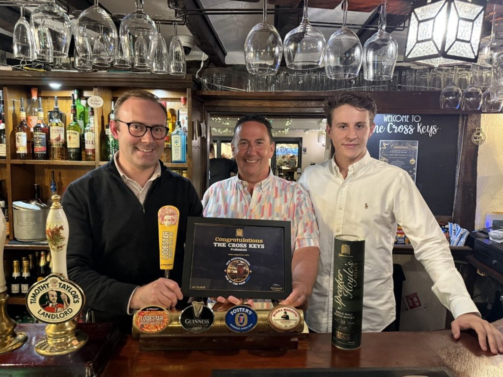Local MP Blake Stephenson presenting award for Mid-Beds Best Pub 2025 to owner Paul Meads