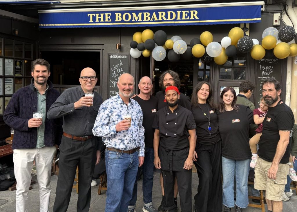 Peter Wells is joined by Anthony Fryer, Ben Smith and other members of The Bombardier team outside the pub